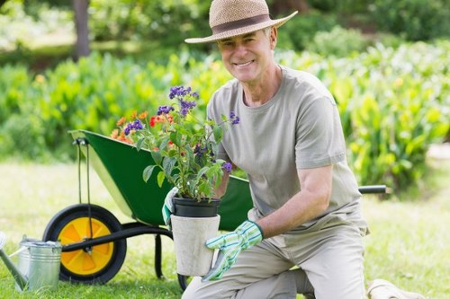 Worker wearing PPE during a landscaping and rubbish removal task